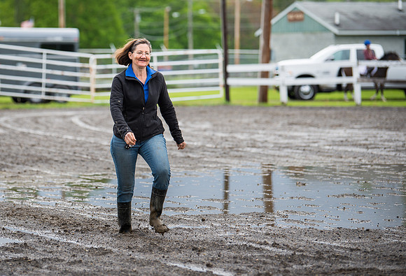 Donna walking in the mud