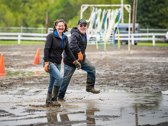 Donna and Mike walking in the mud